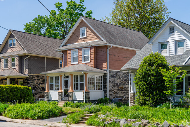 Screened-in front porches and quaint and cozy gardens make visitors feel  welcome in Narbeth.