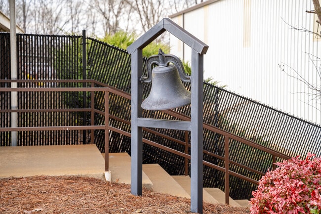 The original school bell still stands in front of Jackson Trail Christian School.