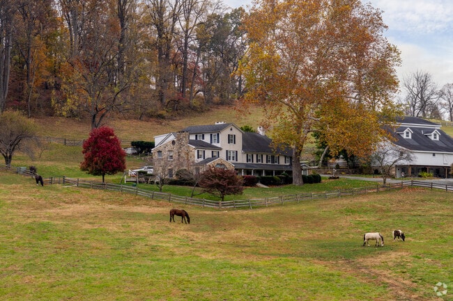 Rolling fields and traditional stone houses define Charlestown’s scenic landscape.