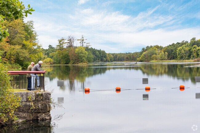 Two friends spend the day fishing at Mine Falls Park in North End Nashua.