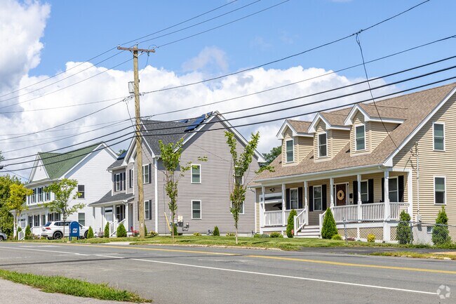 A row of Colonial Revival and Cape Cod inspired homes in the Broad Hill neighborhood.
