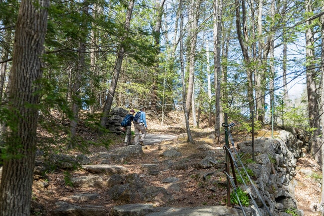 Hikers trek up the hill towards the upper lookout of Doane's Falls in Royalston.