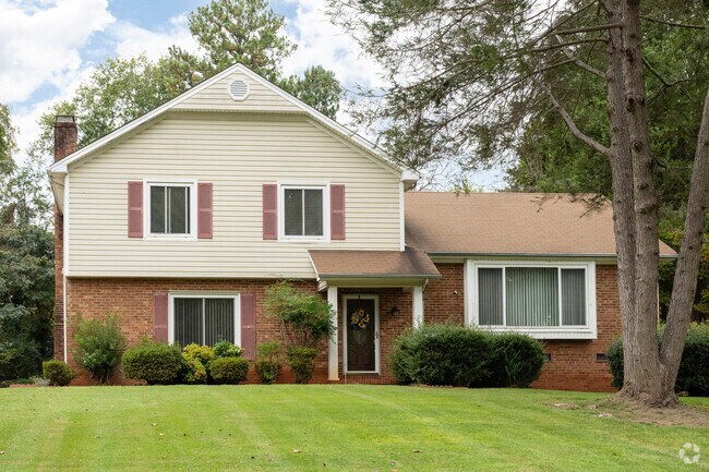 Split-level homes and well-manicured lawns.