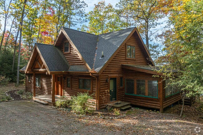 The Bear Lake neighborhood has log cabins by the lake.