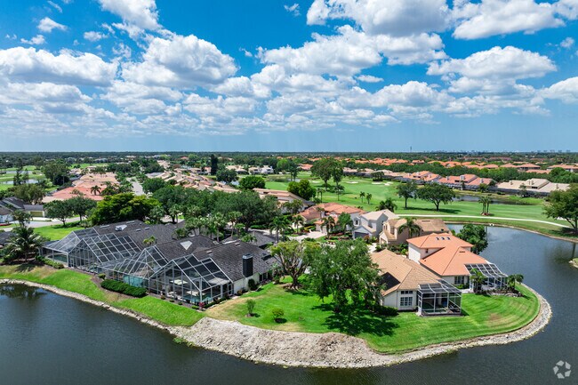 Quail Creek Village features single and multi-family homes built along a lake and golf course.
