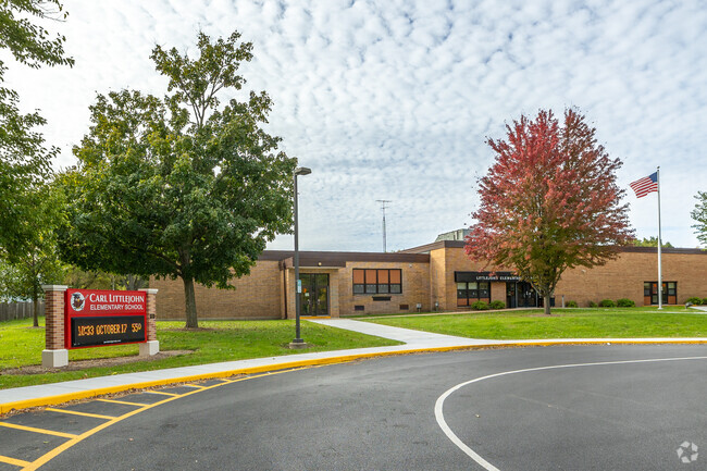 Littlejohn Elementary front entrance of the school with fall changing leaves in Dekalb.