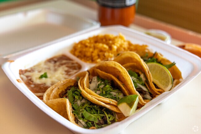 The steak tacos at Los Tres Amigos are authentic and delicious.