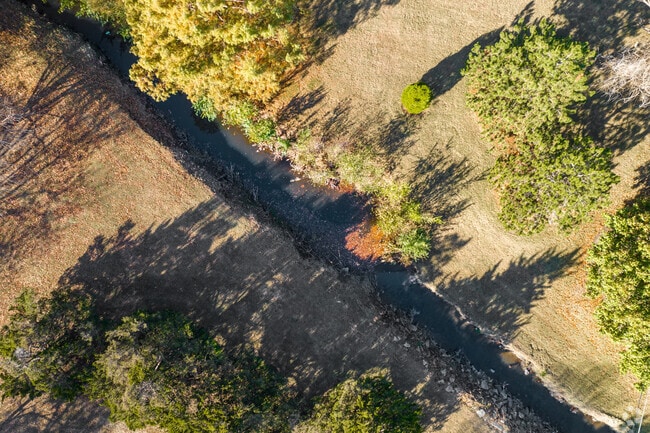 A small creek runs along the edge of Village in Wichita, Kansas.