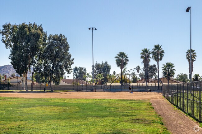 A Hendrick Ranch resident gears up to hit baseballs at Woodland Park, ready for a fun and energetic practice session in the heart of this vibrant community park.
