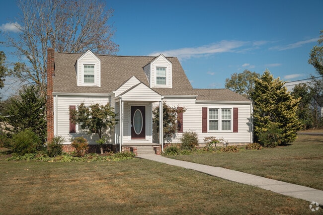 A cape cod influenced cottage graces the landscape of Ooltewah Center.