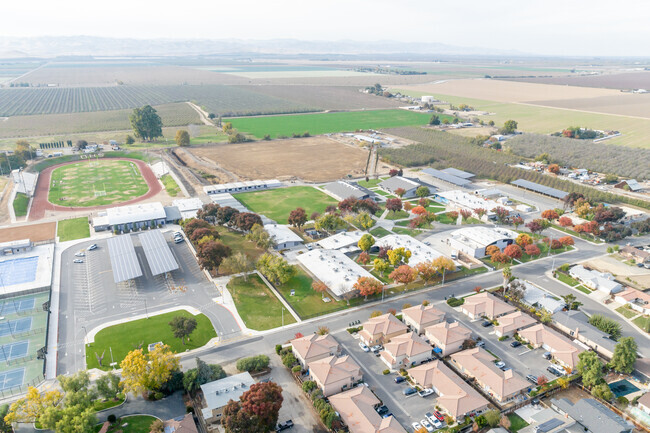 Orestimba High School serves as a buffer between farm land and new homes.
