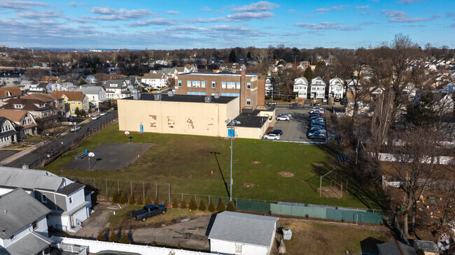 The Jefferson School has a large exterior courtyard with grass for students.