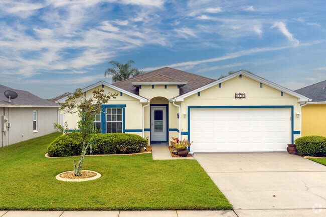 This beautiful Coraci home features a unique blue accent, enhancing its exterior charm.