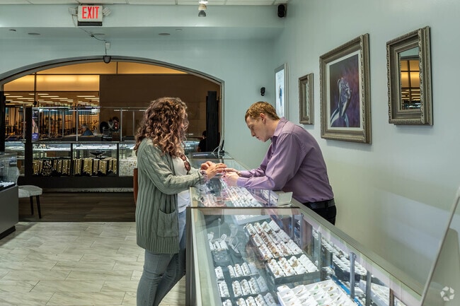 A jeweler assists a customer at Brazos Mall in Lake Jackson.