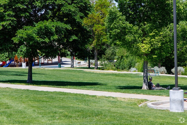 Kirtland Park has a sprawling grass field for residents to relax on.