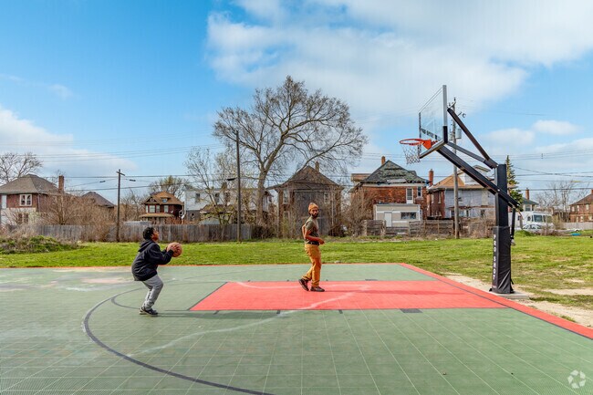 Highland Park residents enjoy a pickup game of basketball.