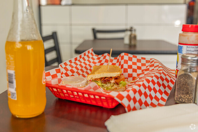 Folks who are hungry can grab a yummy bite to eat at Mr. Burger in Manhattan's retail core.
