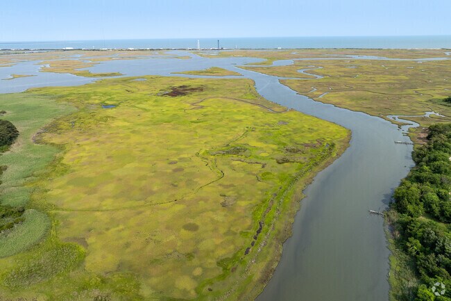 A view toward NASA’s Wallops Flight Facility near Atlantic, where rocket launches regularly draw crowds and fuel the local economy with aerospace jobs and tourism buzz.
