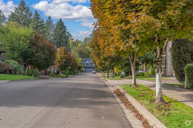 Blue Heron’s serene tree-lined streets create a picturesque setting for luxury homes, blending natural beauty with upscale Lake Oswego living.