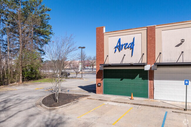 Nestled in the vibrant neighborhood of Greenbriar, Area 4 Restaurant offers a delightful dining experience characterized by its artistic decor, featuring high ceilings adorned with intricate designs and a warm, inviting ambiance created by colorful lighting.