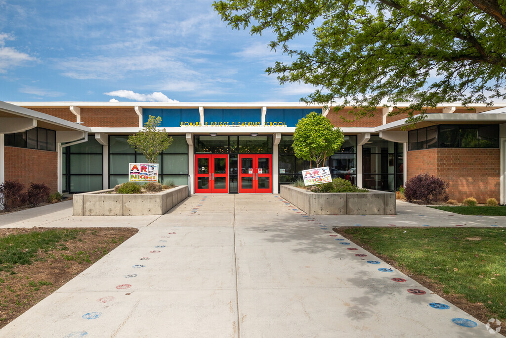 Red double doors welcome students into Howard R Driggs Elementary School in Holladay.