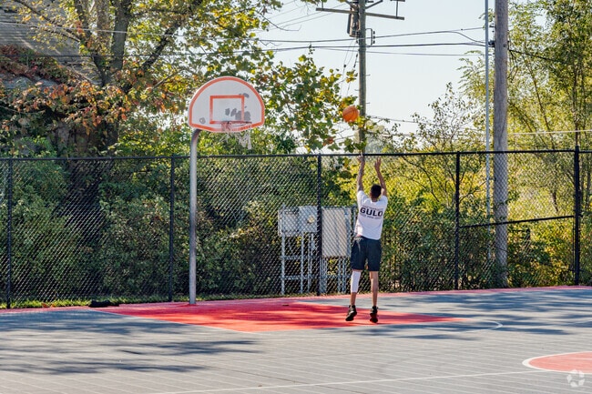 Wellston residents enjoy shooting some hoops in Trojan Park.