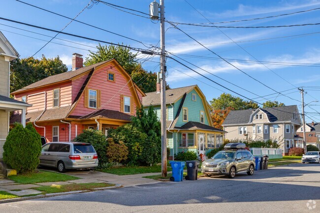 Two Dutch Colonial homes in Eden Park stand out with their pink and teal exteriors.