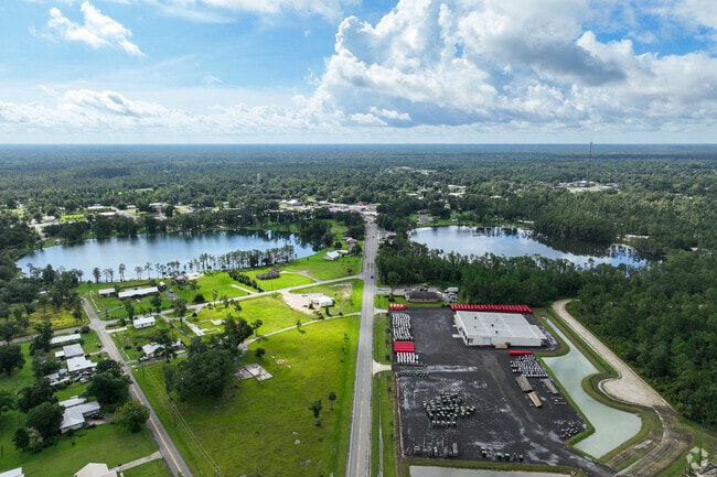 Twin lakes shimmer beneath Florida pines in the quiet town of Wewahitchka.