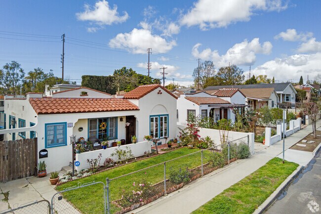 These Spanish-style homes line a residential street in the Palms neighborhood.