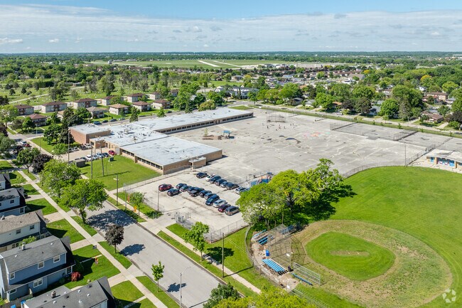 Bryant Elementary School in Milwaukee, WI offers a large asphalt area for kids tp run and play.