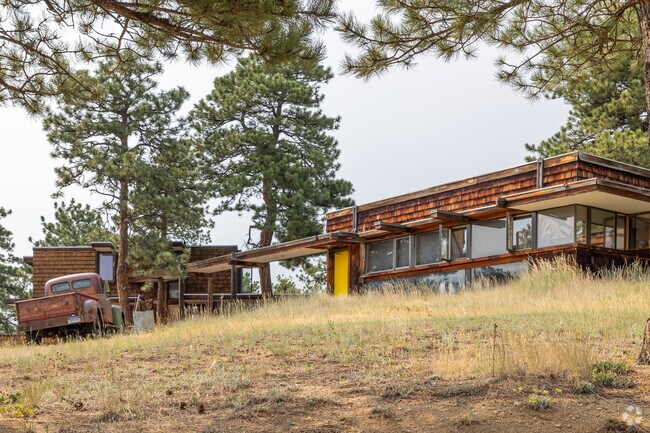 This rustic old shingle-style cabin fits the rural atmosphere of Seven Hills.
