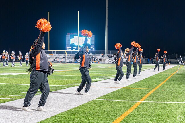 Washington Tiger cheerleaders bring Downtown Massillon fans to their feet to cheer on team.
