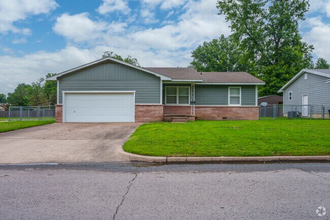 A modest ranch style home with a large front yard in the heart of Pryor Creek.