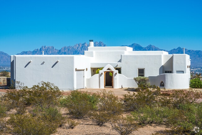 The white stucco home in Picacho Hills can be seen with the Organ Mountains in the distance.