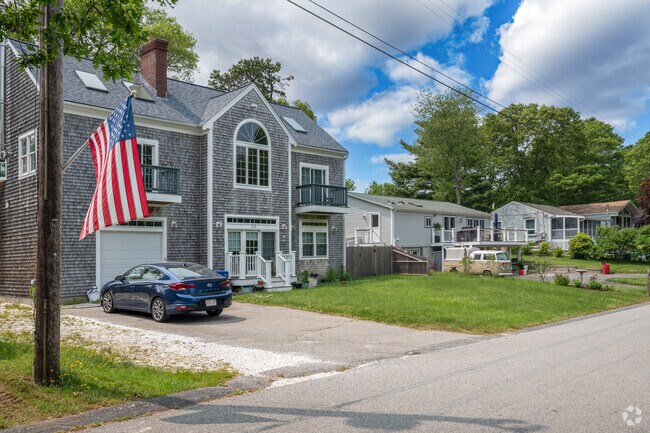 Rows of homes line the patriotic streets of Marstons Mills.