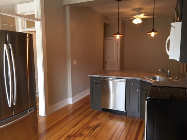 Kitchen looking into living room