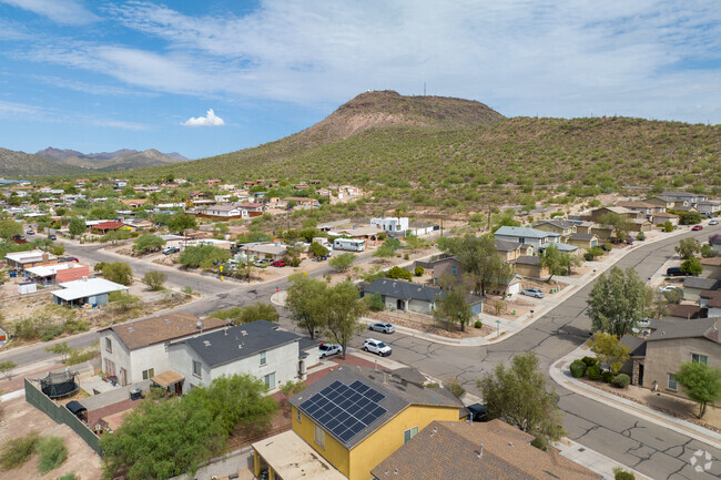 Tumamoc Hill sits in the distance behind the neighborhood of A Mountain.