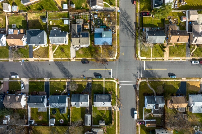 Homes in Iselin, NJ feature spacious lawns and backyards.