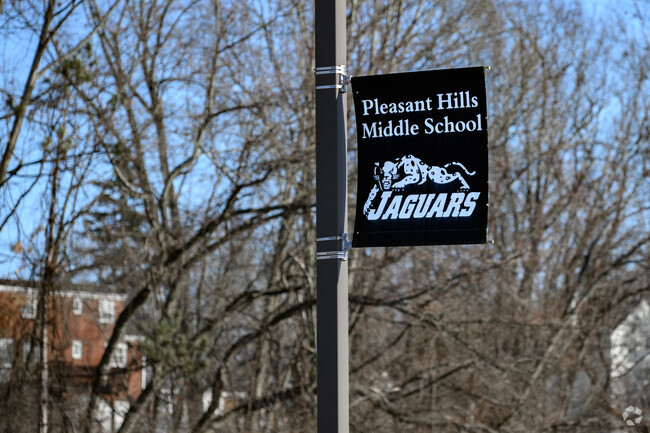 Local residents show support for Pleasant Hills Middle School by cheering on the Jaguars.