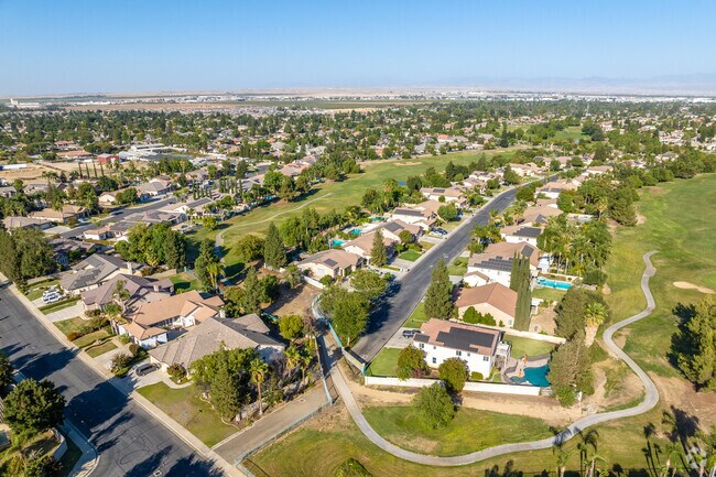 An aerial view of Eagle Ranch featuring homes and a golf course.