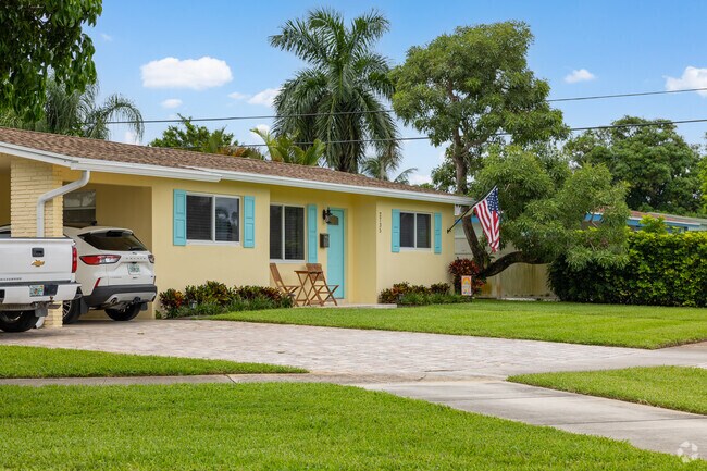 Colorful traditional home with well maintained front yard in Prairie neighborhood.