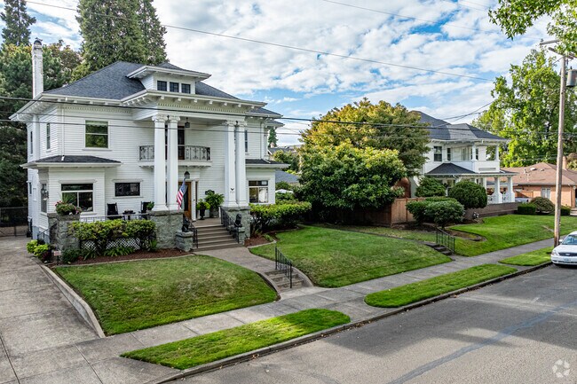Large victorian and historical homes line the streets of the Broadway-Albany neighborhood.
