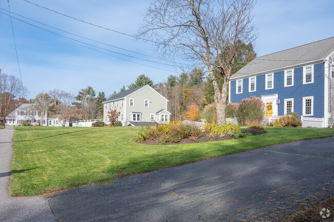 A row of Colonial Revival homes lines a street in Hanover, Massachusetts.