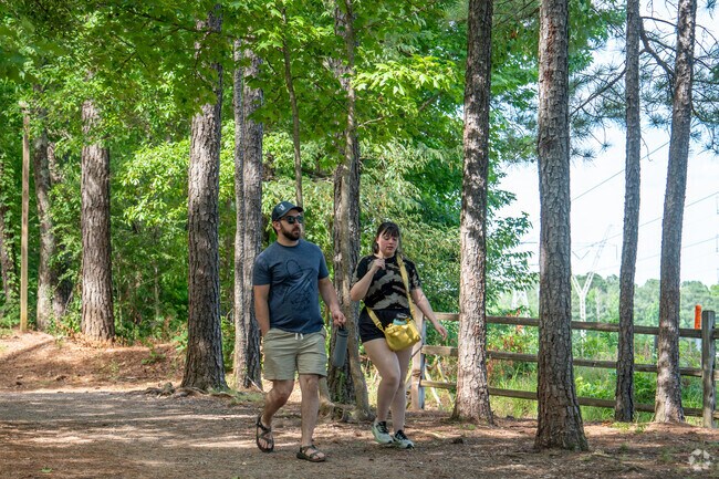 Hike with a friend at Red Mountain Park near West End Manor.