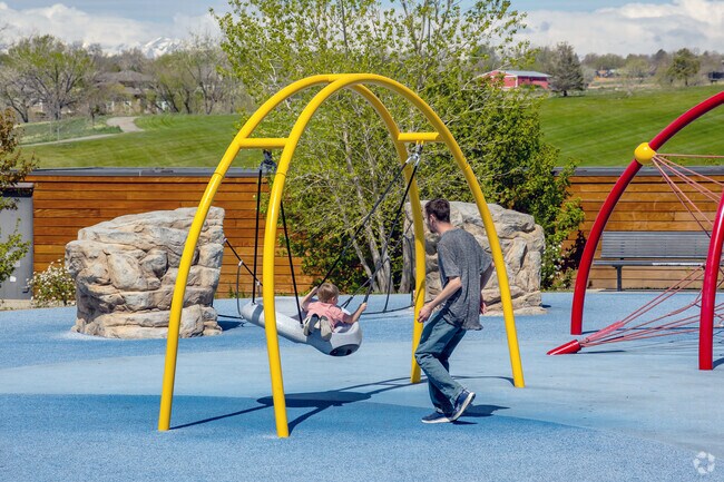 Families in Wyndemere, Thornton, CO enjoy Carpenter Park's colorful playground.