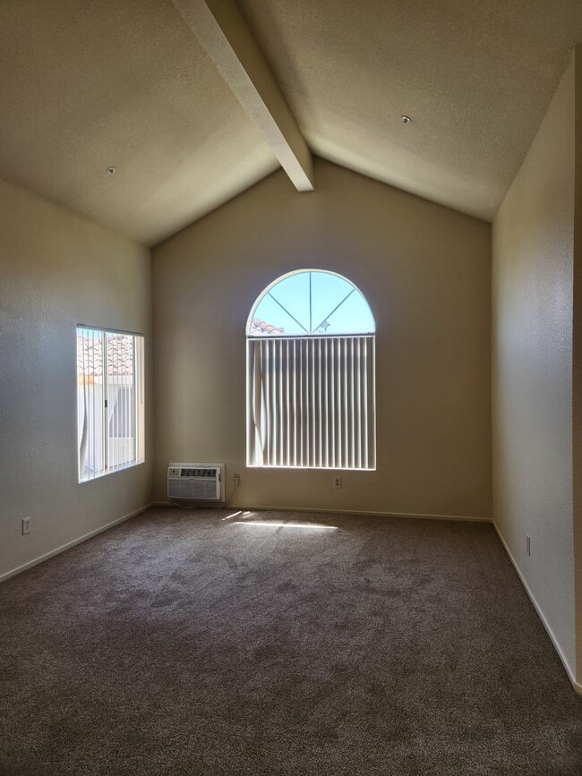 Living room with vaulted ceiling