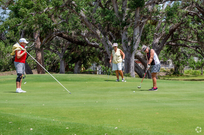 Friends enjoy the Fruitville sunshine on the course at Bobby Jones Golf Club.