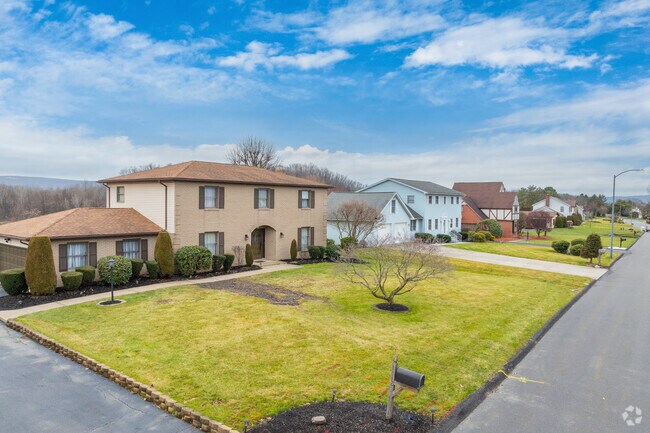 Traditional American family homes are seen with some 80s style flare in Hilldale.