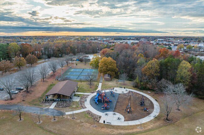 Bolton Park offers tennis courts, a playground, a shelter, and a community pool.