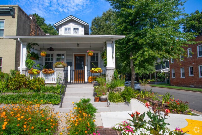 Corner lot bungalow in Carytown with beautiful greenery.